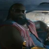 cyberpunk dexter deShawn in car wearing red leather vest