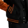 mens black wool and orange leather varsity letterman jacket pocket close-up