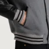 men's gray wool and black leather varsity jacket pocket close-up