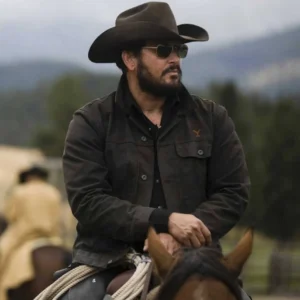 rip wheeler wearing black cotton jacket and riding on horse